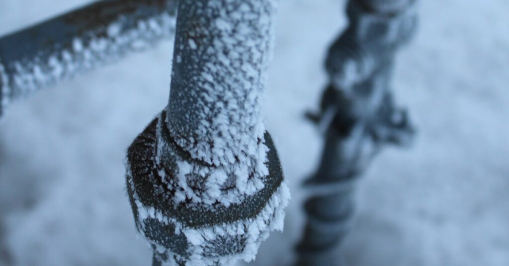 a close up of a pipe with snow on it