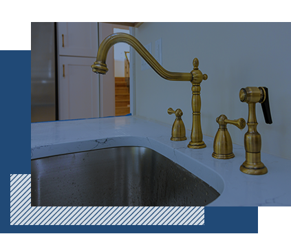 A modern, gold kitchen sink fixture