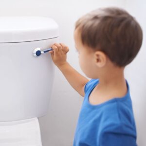 a child flushing a toilet